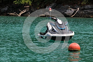 Jet ski moored to a mooring buoy in the sea