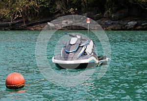 Jet ski moored to a mooring buoy in the sea