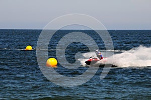 Jet ski racing around buoys