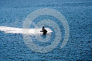 Jet Ski Sillouette on Blue photo