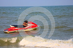 Jet ski stand by on the beach for support traveler. extreme sport on the sea or the beach and high speed.