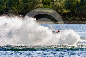 Jet ski watercraft driver in action on summer sunny day