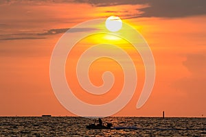 Jet-Skier and sunset at Bangsaen , Chonburi, Thailand