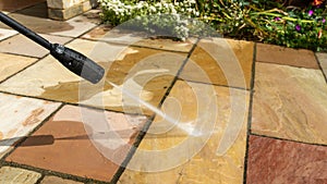 Jet washing natural stone garden paving