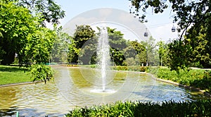 Jet of water in the pond of the MosÃÂ©n Cinto Verdaguer gardens in Montjuic photo