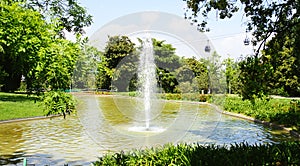 Jet of water in the pond of the MosÃ©n Cinto Verdaguer gardens in Montjuic