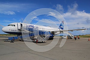 JetBlue Embraer 190 plane on tarmac at Maurice Bishop International Airport in Grenada