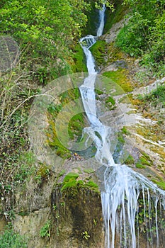 Jets of flowing water from a mountain waterfall
