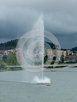 jets or fountains of water projected from the surface of the Mondego River in the city of Coimbra.