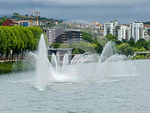 jets or fountains of water projected from the surface of the Mondego River in the city of Coimbra.