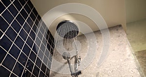 Jets of water flow from round shower head