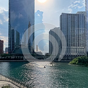 Jetski riders on the Chicago River after a storm clears and clouds open up