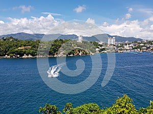 Jetski sailing in the sea from La Roqueta Island photo