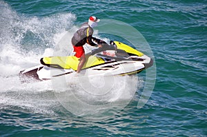 Jetskier Riding Waves on a Speeding Jetski photo