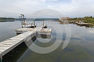 Jetties of fishing boats of Urbino Laguna in Corsica Island