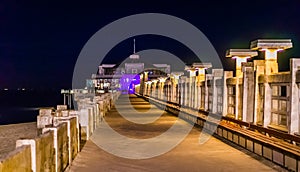 On the jetty of blankenberge beach, belgium, popular city architecture by night