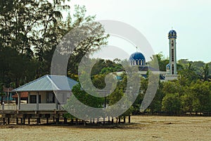 Jetty and a blue mosque in Teluk Sengat, Kota Tinggi, Johor, Malaysia.