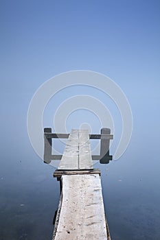 Jetty on Bohinj Lake in Slovenia on a misty morning