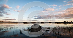 Jetty in calm lake in Sweden