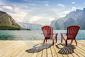 Jetty with chairs by Minnewanka Lake, Alberta, Canada