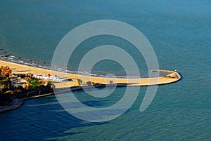 A jetty curls as it enters Lake Michigan,