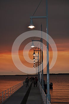 Jetty with lights and fishermen at sunset Perth Rockingham Western Australia