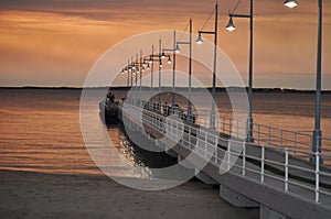 Jetty with lights at sunset Perth Rockingham Western Australia