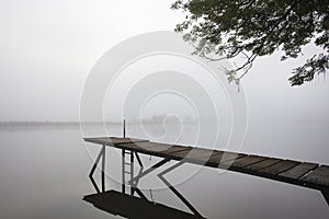 Jetty in the misty river Meuse