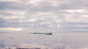 Jetty in the sea on a cloudy day in autumn