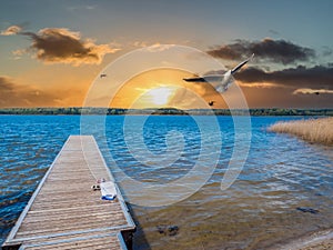 Jetty in the sunset at the Mecklenburg Lake District