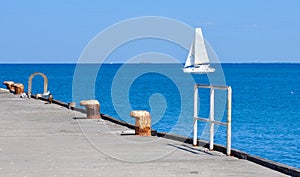 Jetty View: Sailboat on the Indian Ocean