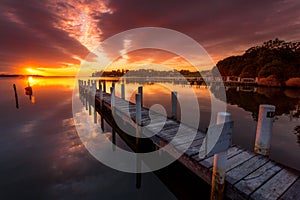 Jetty with views to sunrise sky