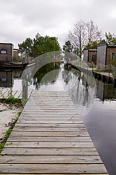 Jetty wood on the lake of sanguinet biscarrosse in wooden houses village of maguide in Landes France