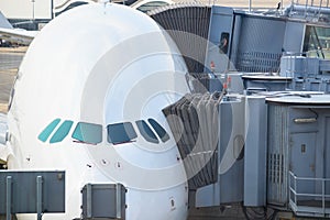 Jetway bridges and airplane waiting boarding photo