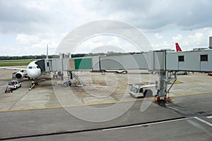 Jetway to a plane in airport photo