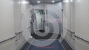 Jetway, walking towards the plane on carpet, seeing the plane door. perspective aerobridge corridor to aircraft.