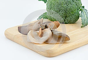 Jew's Ear Mushroom broccoli and asparagus on cutting board isola