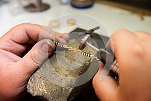 Jeweler hands at work