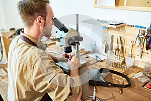 Jeweler Inspecting Stones