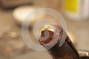 Jeweler making rings