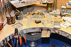 Jeweler`s workplace with a multitude of working tools