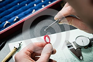 Jeweler working with wax model ring