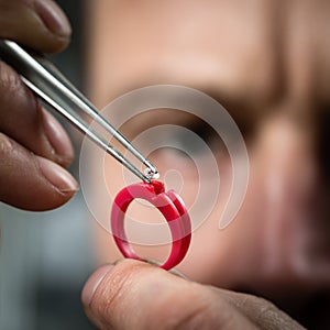 Jeweler working with wax model ring