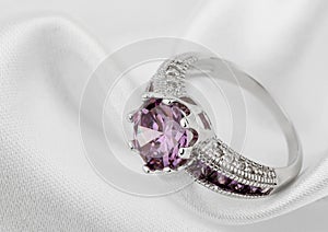 Jewelery ring on white cloth background, copy-cpace