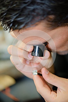 Jeweller appraising a ring