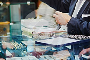 Jeweller with many wedding ring samples