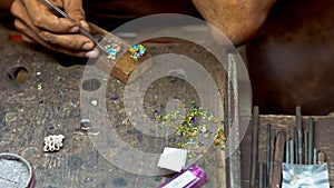 Jeweller working with earrings