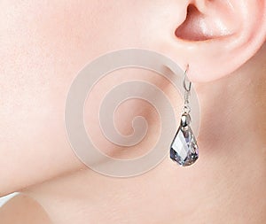 Jewellery ear-ring in an ear
