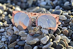 Jewellery and glasses in the summer on stones