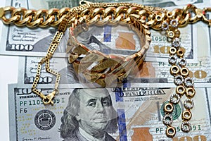 Jewellery or jewelry with USD American dollars cash money banknotes, brooches, rings, necklaces, earrings, pendants, bracelets,